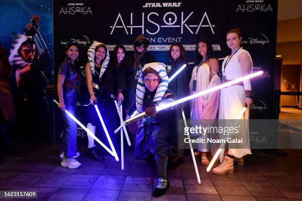 Fans in cosplay pose during the Ahsoka Fan Event at AMC Empire 25 on August 17, 2023 in New York City.