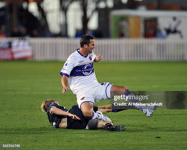 Midfielder Ian Fuller of Orlando City tumbles against the Philadelphia Union February 9, 2013 in the first round of the Disney Pro Soccer Classic in...