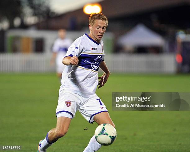 Defender Bryan Burke of Orlando City runs upfield against the Philadelphia Union February 9, 2013 in the first round of the Disney Pro Soccer Classic...