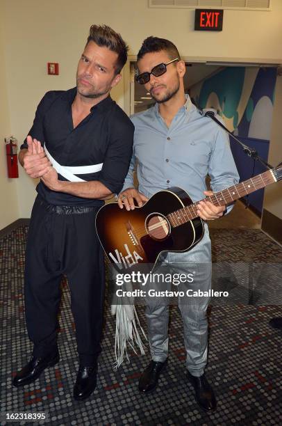 Ricky Martin and Robi Draco Rosa pose backstage at 25th Anniversary Of Univision's "Premio Lo Nuestro A La Musica Latina" on February 21, 2013 in...