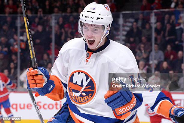 Thomas Hickey of the New York Islanders celebrates his game-winning overtime goal during the NHL game against the Montreal Canadiens at the Bell...