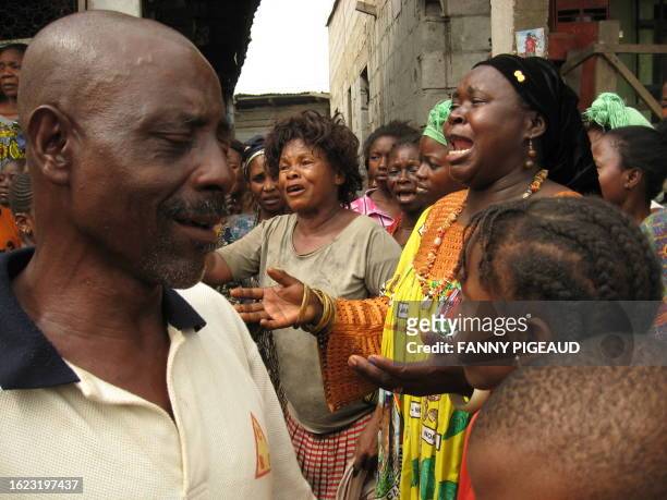 Relatives gather on February 24, 2008 in the Madagascar district of Douala in front of the house of Raoul, a 20-year-old man who was reportedly shot...