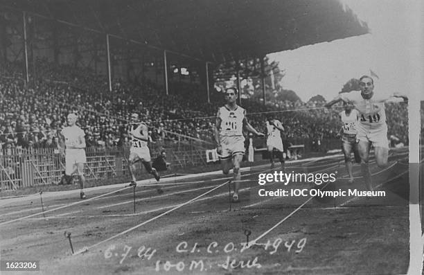 The competitors approach the finishing line in one of the 100-meter heats at the 1924 Olympic Games in Paris. Harold Abrahams of Great Britain would...