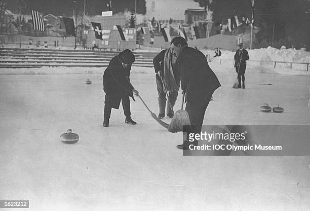 Gaston Vidal of France, Under-Secretary of State for technical education, in action during the Curling event at the 1924 Winter Olympic Games in...