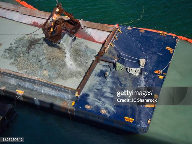 dredging grab bucket and barge - dredger stock pictures, royalty-free photos & images