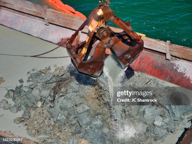 emptying dredge bucket - dredger stock pictures, royalty-free photos & images