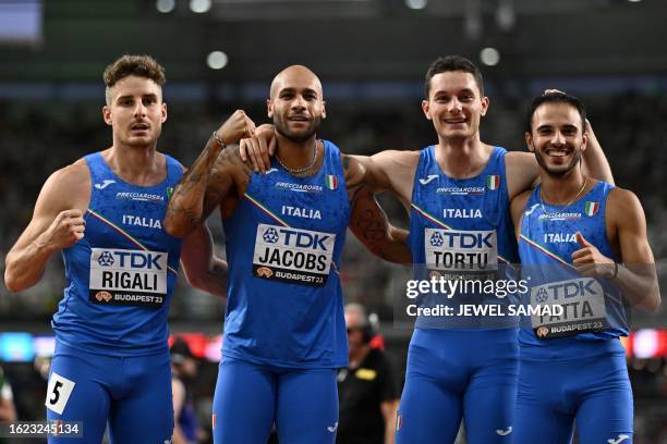 Italy's Roberto Rigali, Italy's Lamont Marcell Jacobs, Italy's Filippo Tortu and Italy's Lorenzo Patta pose for a picture after the men's 4x100m...