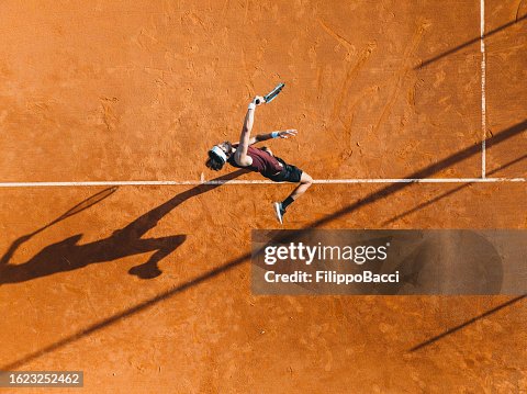 Aerial view of a tennis player during a match Aerial view of a tennis player during a match