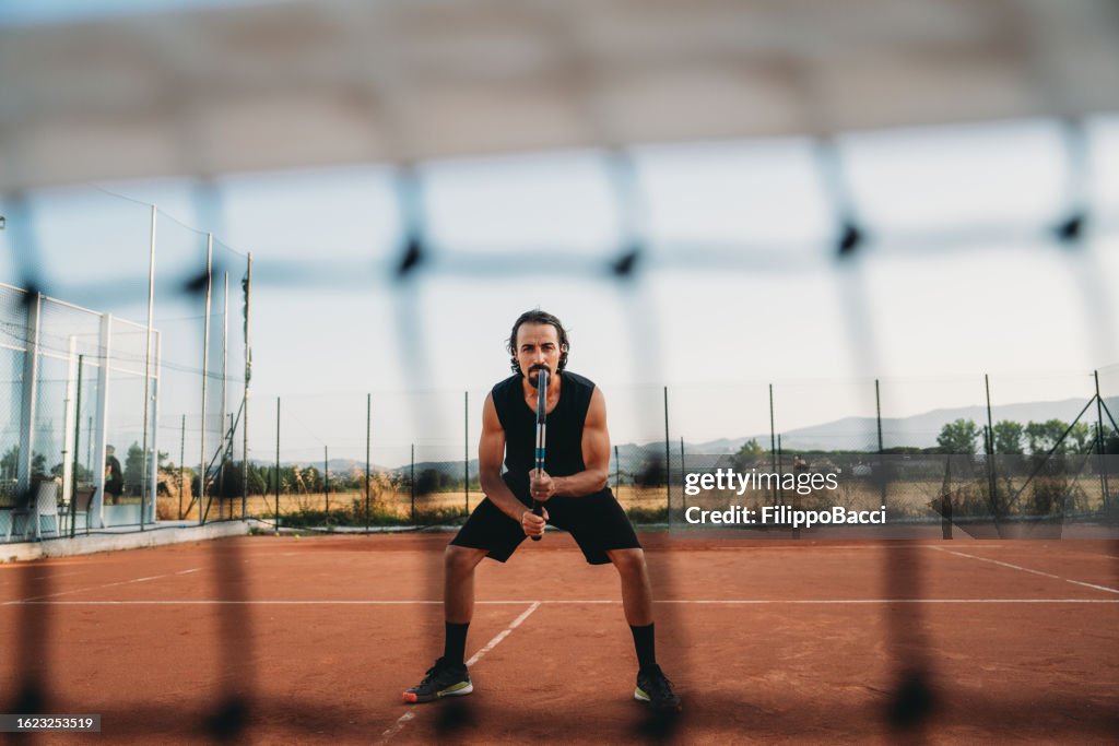 Tennis player focusing on the match