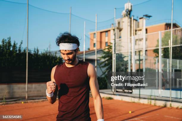 a tennis player is celebrating his victory - finals game one stock pictures, royalty-free photos & images