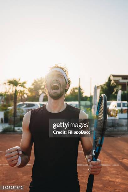 a tennis player is celebrating his victory - finals game one stock pictures, royalty-free photos & images