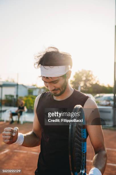 a tennis player is celebrating his victory - finals game one stock pictures, royalty-free photos & images