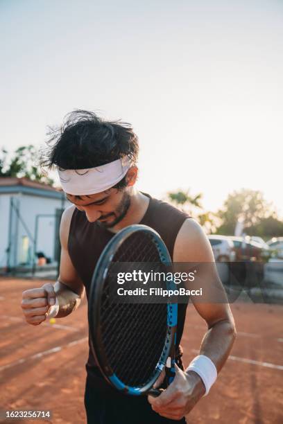 a tennis player is celebrating his victory - match final stock pictures, royalty-free photos & images