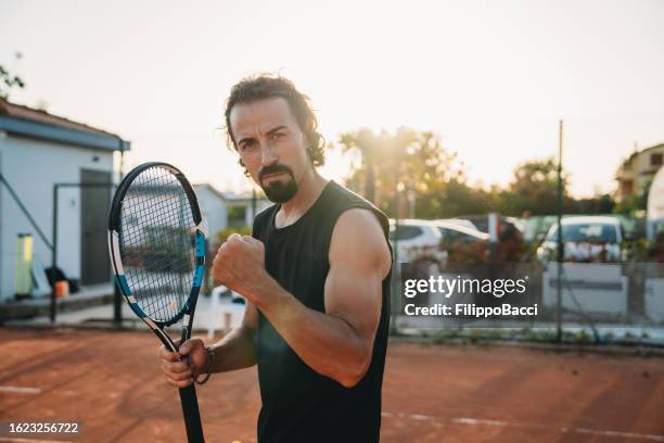 a tennis player is celebrating his victory - match final stock pictures, royalty-free photos & images