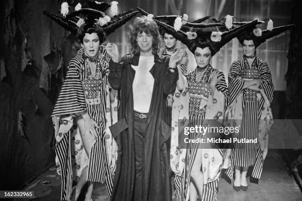 Italian choreographer Bruno Tonioli with Mick Jagger on the set of the Rolling Stones' music video for 'One Hit ', England, 6th May 1986.