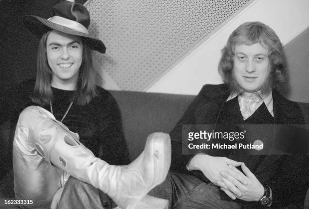 Guitarist Dave Hill and singer Noddy Holder of English glam rock group Slade, 1973. Holder is wearing a 'Cum on feel the noize' badge.