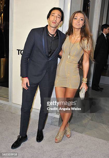 Actor Adrien Brody and girlfriend Lara Leito attend Tom Ford's cocktail event in support of Project Angel Food at TOM FORD on February 21, 2013 in...