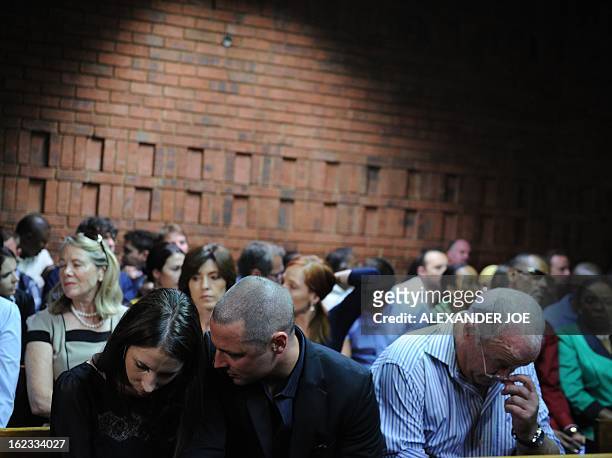 Relatives of South African Olympic sprinter Oscar Pistorius, his sister Aimee, his brother Carl, and his father Henke appear on February 22, 2013 at...