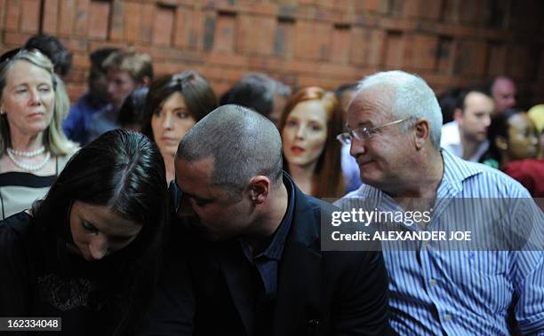 Relatives of South African Olympic sprinter Oscar Pistorius, his sister Aimee, his brother Carl, and his father Henke appear on February 22, 2013 at...