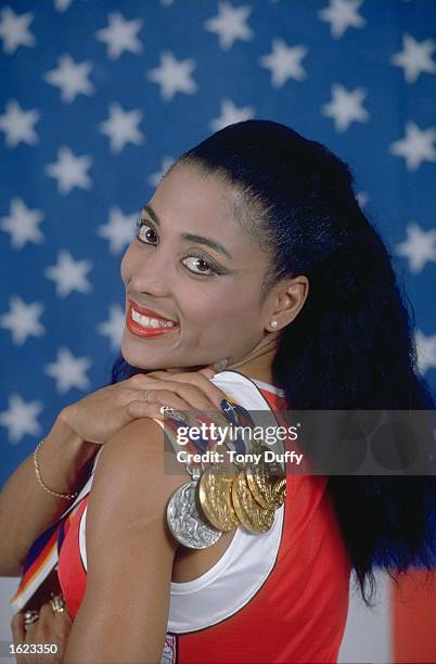 Florence Griffith Joyner of the United States displays her medals at the 1988 Olympic Games during a studio feature in Seoul, South Korea. Mandatory...