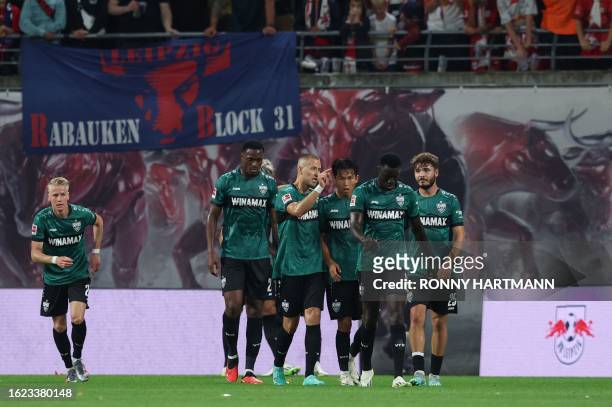 Stuttgart's players celebrates scoring the opening goal during the German first division Bundesliga football match between RB Leipzig and VfB...