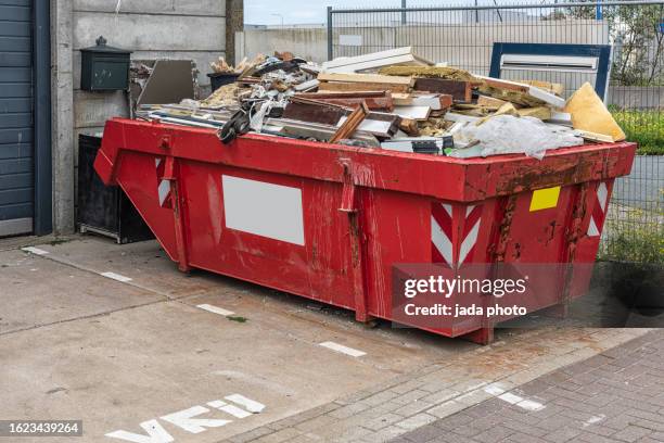 open red metal industrial waste container - skip bin stock pictures, royalty-free photos & images