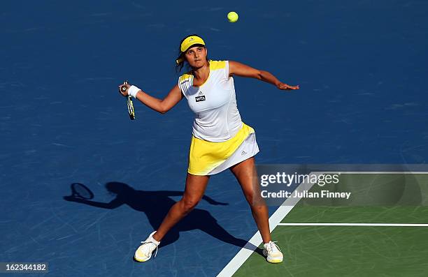 Sania Mirza of India in action with partner Bethanie Mattek-Sands of USA in their doubles semi final match against Cara Black of Zimbabwe and...