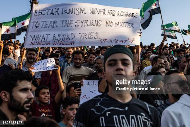 August 2023, Syria, Idlib: Syrians take part in a demonstration against the Syrian President Bashar al-Assad's regime and in support of...