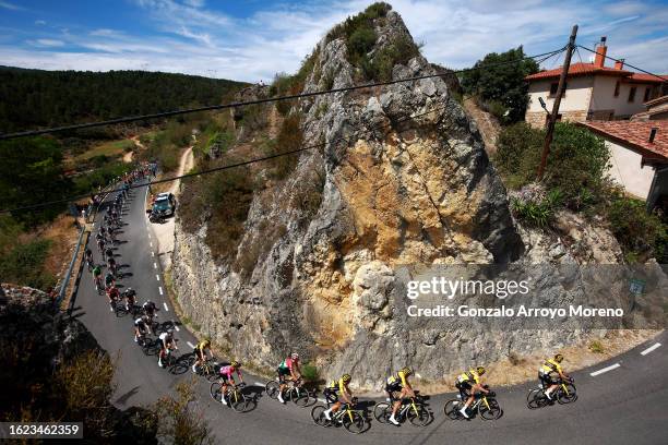 Primoz Roglic of Slovenia and Team Jumbo-Visma - Purple Leader Jersey and a general view of the peloton passing through Frias Village during the 45th...