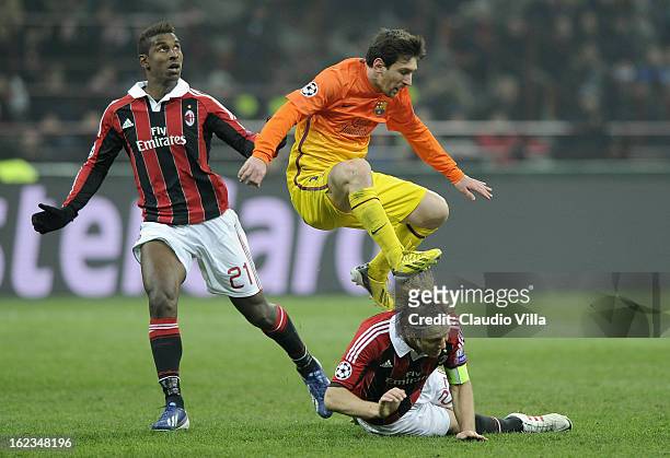 Lionel Messi of FC Barcelona compete for the ball with Massimo Ambrosini of AC Milan during the UEFA Champions League Round of 16 first leg match...