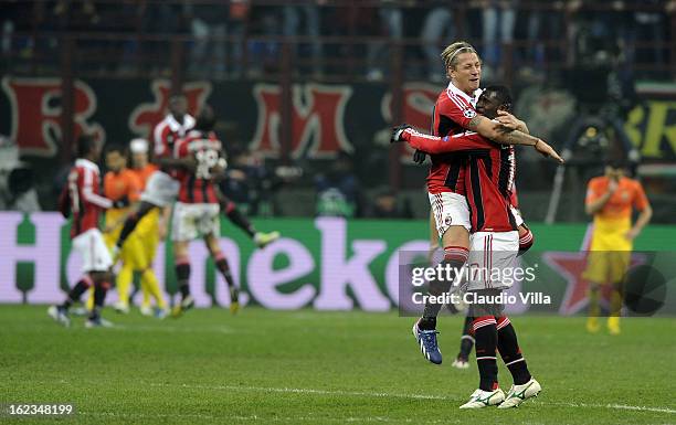 Philippe Mexes and Cristian Zapata of AC Milan celebrate victory at the end of the UEFA Champions League Round of 16 first leg match between AC Milan...