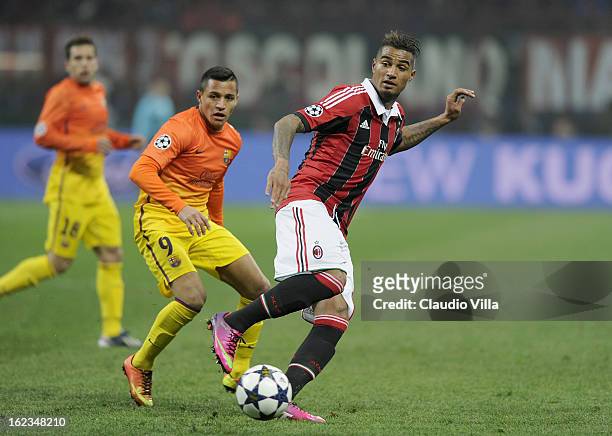 Alexis Sanchez of FC Barcelona compete for the ball with Kevin Prince Boateng of AC Milan during the UEFA Champions League Round of 16 first leg...