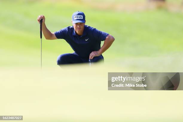 William Mouw putts on the tenth green during the second round of the Magnit Championship at Metedeconk National Golf Club on August 18, 2023 in...