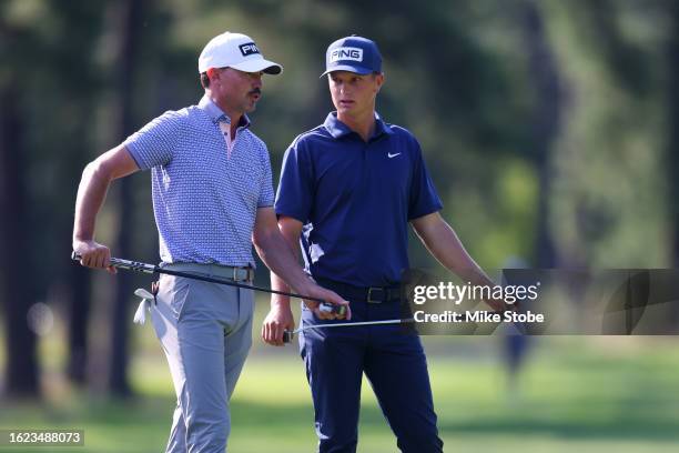 William Mouw and Paul Peterson talk on tenth green during the second round of the Magnit Championship at Metedeconk National Golf Club on August 18,...