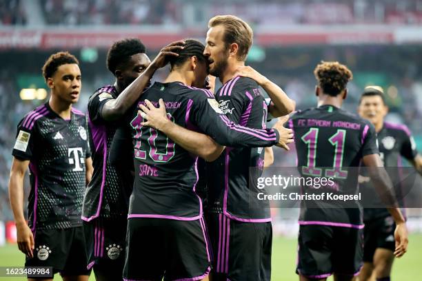 Leroy Sane of Bayern Munich celebrates with teammates after scoring the team's first goal during the Bundesliga match between SV Werder Bremen and FC...