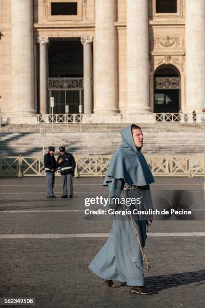 Faithful walks in St. Peters' Square on February 19, 2013 in Vatican City, Vatican. Pope Benedict XVI will hold his last weekly public audience on...