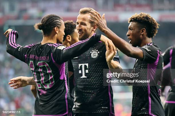 Leroy Sane of Bayern Munich celebrates with teammates after scoring the team's first goal during the Bundesliga match between SV Werder Bremen and FC...
