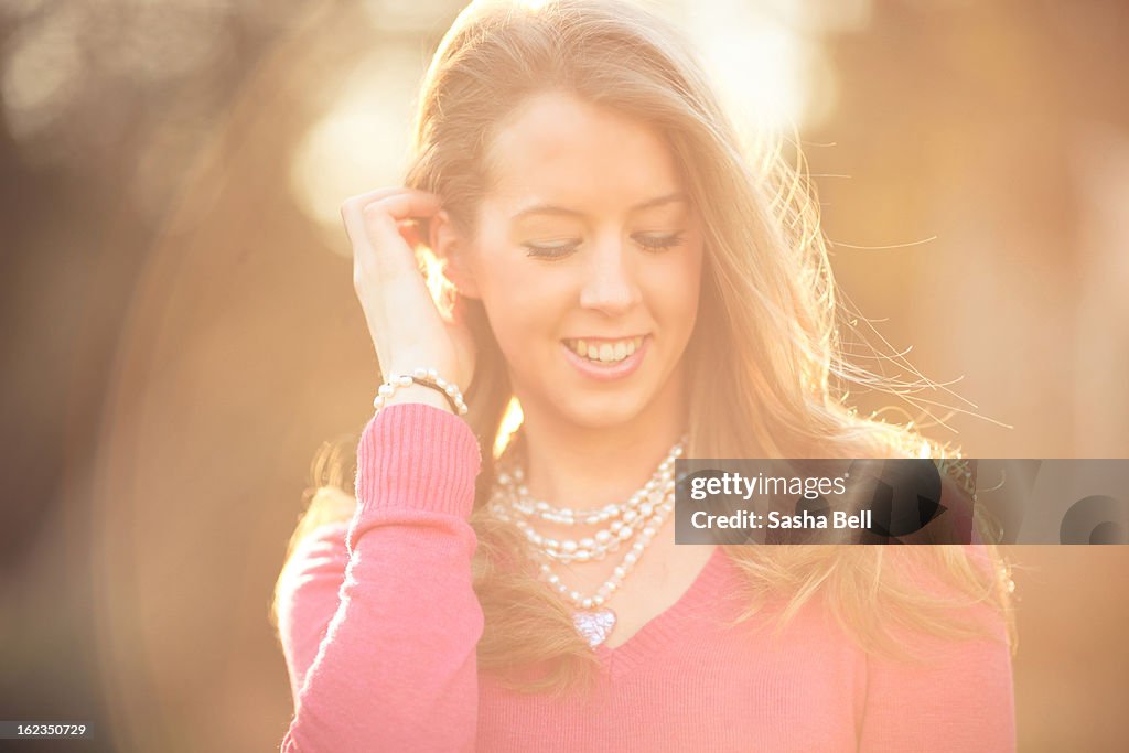 Portrait of Blonde Haired Girl Smiling In The Sun