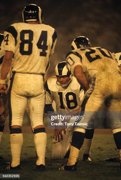 Los Angeles Rams QB Roman Gabriel with teammates in huddle during game vs St. Louis Cardinals at Busch Memorial Stadium. St. Louis, MO 9/15/1968...