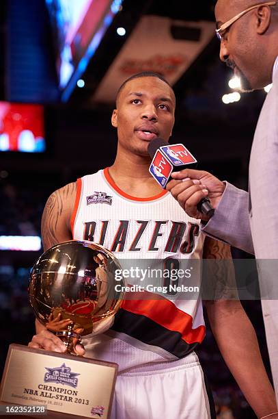 Skills Challenge: Portland Trail Blazers Damian Lillard victorious with trophy after winning challenge during All-Star Weekend at Toyota Center....