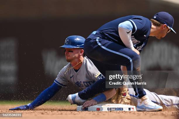 Drew Waters of the Kansas City Royals slides in to steal second base in third inning against Nico Hoerner of the Chicago Cubs at Wrigley Field on...