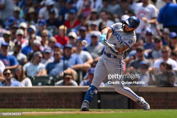 Kyle Isbel of the Kansas City Royals hits an RBI single in the third inning against the Chicago Cubs at Wrigley Field on August 18, 2023 in Chicago,...