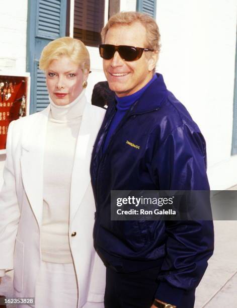 Actor Wayne Rogers and date Amy Hirsh attend Pierre Cossette's Viewing Party for Super Bowl XXII - Washington Redskins vs. Denver Broncos on January...