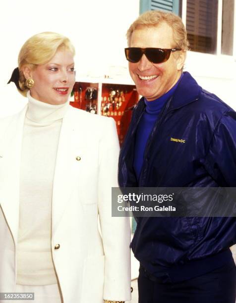 Actor Wayne Rogers and date Amy Hirsh attend Pierre Cossette's Viewing Party for Super Bowl XXII - Washington Redskins vs. Denver Broncos on January...