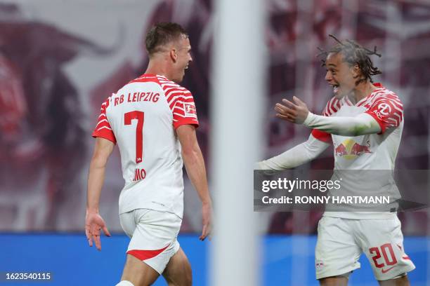 Leipzig's Spanish forward Dani Olmo celebrates scoring the 2-1 goal with his team-mate Leipzig's Dutch midfielder Xavi Simons during the German first...