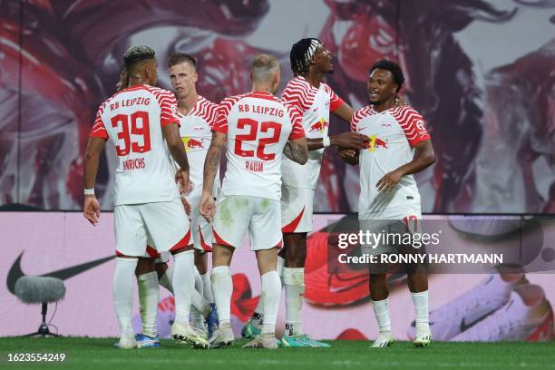 Leipzig's Belgian forward Lois Openda celebrates scoring the 3-1 goal with his team-mates during the German first division Bundesliga football match...