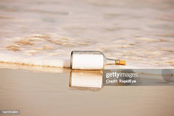 blank note in washed-up bottle: you add the message - message in a bottle stock pictures, royalty-free photos & images
