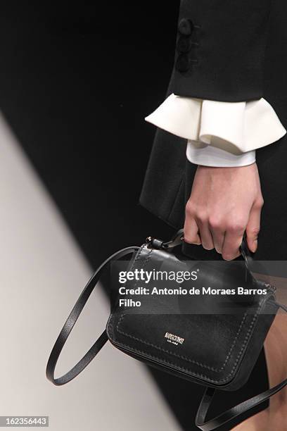 Model walks the runway during the Moschino show as a part of Milan Fashion Week Fall/Winter 2013/14 on February 22, 2013 in Milan, Italy.