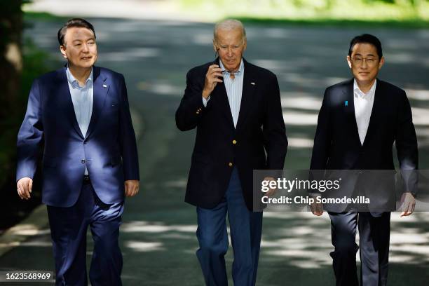 South Korean President Yoon Suk Yeol, U.S. President Joe Biden and Japanese Prime Minister Kishida Fumio arrive for a joint news conference following...