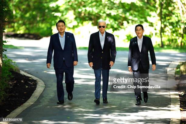 South Korean President Yoon Suk Yeol, U.S. President Joe Biden and Japanese Prime Minister Kishida Fumio arrive for a joint news conference following...